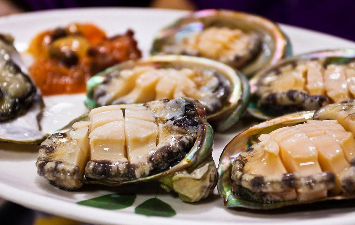 Co To Abalone is one of the island’s most prized delicacies — firm, flavorful, and packed with ocean freshness