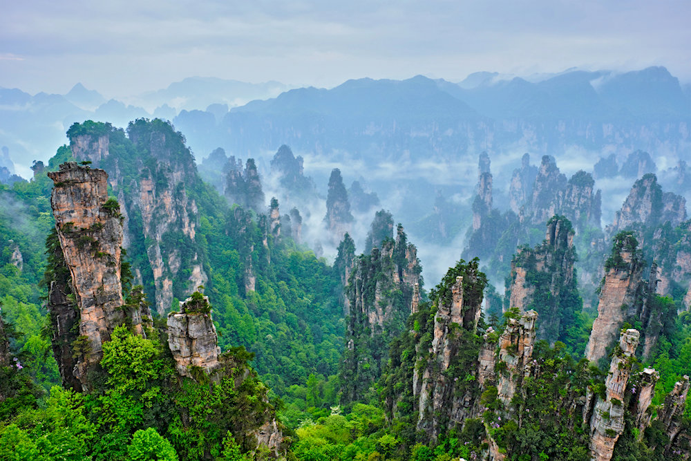 Towering stone pillars veiled in mist inspired the floating mountains in the movie Avatar