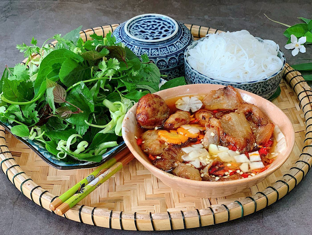 Bun Cha satisfies food lovers with its flavorful grilled pork, rice noodles, and fresh herbs