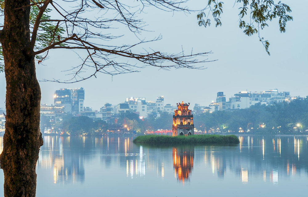 Hoan Kiem Lake offers a peaceful escape in the heart of Hanoi, where locals and tourists come to relax