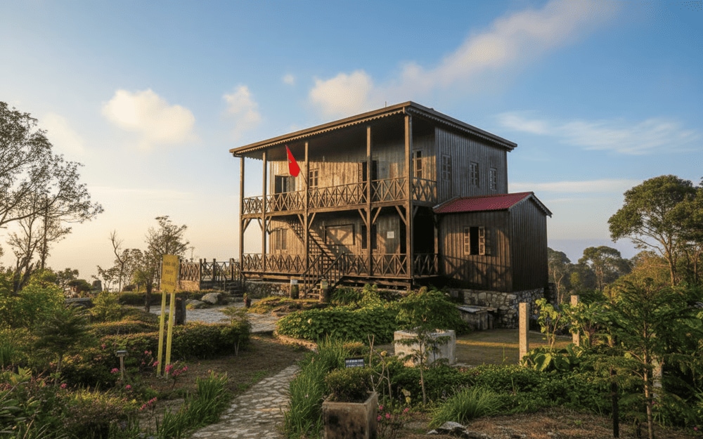 A tranquil replica of Dr. Yersin’s retreat on Hon Ba Peak, surrounded by lush greenery and misty mountains