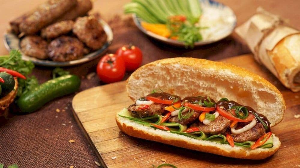 Their banh mi is served warm, packed with flavorful meat, and topped with fresh vegetables and herbs