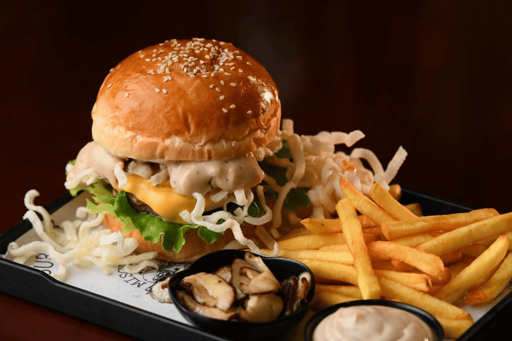 Burger at Mischief & Mayhem with succulent beef, cheese, bacon, and special sauce (Source: Mischief & Mayhem Burgers)