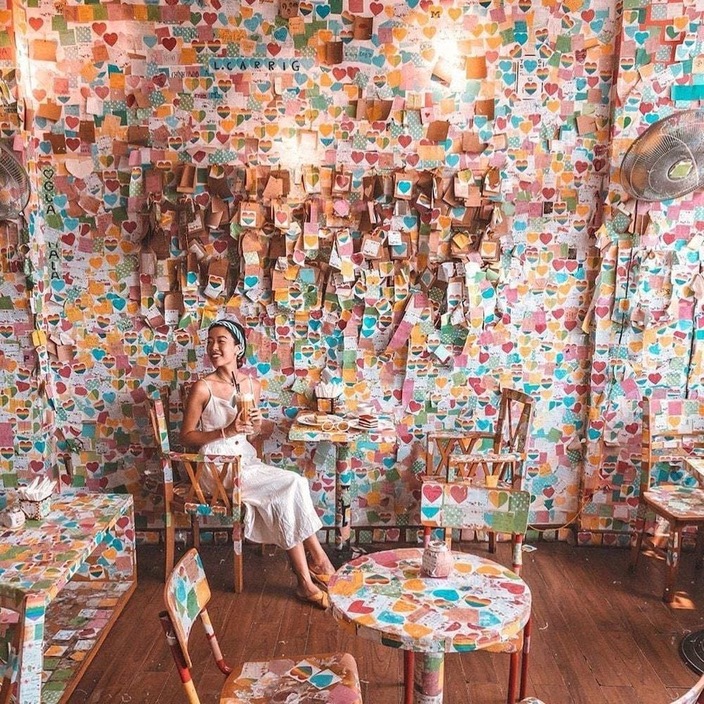 Thousands of handwritten notes from around the world create a whimsical atmosphere