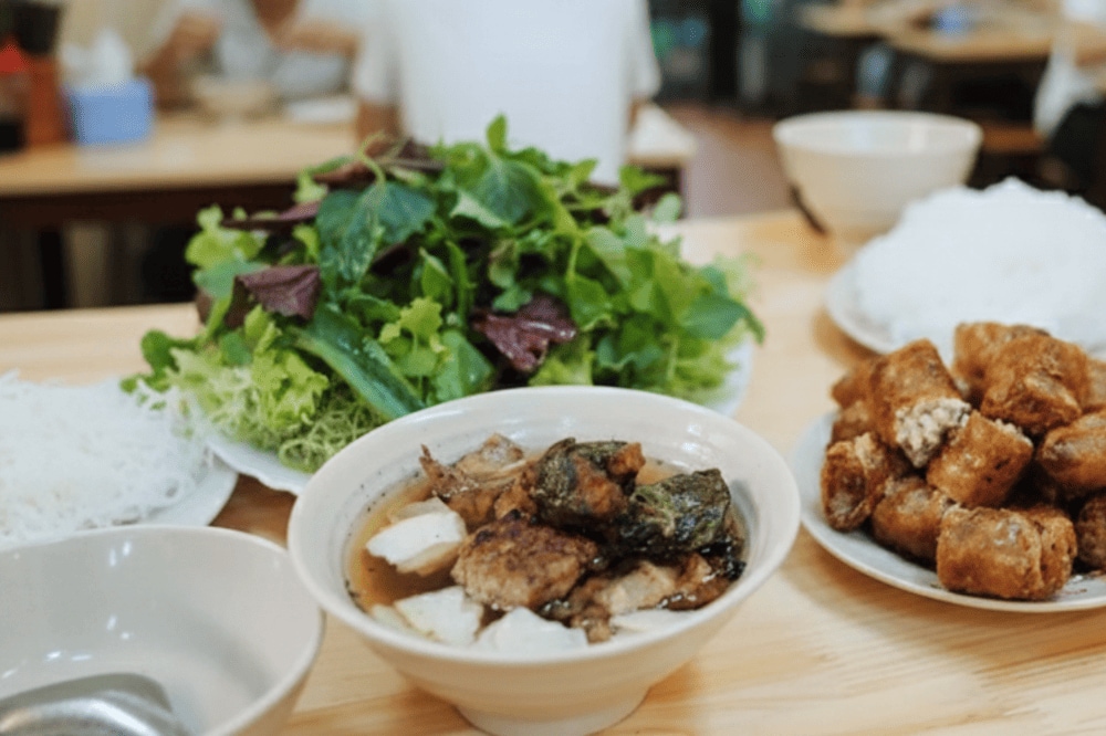 Delicious grilled pork with crispy crab spring rolls, perfectly balanced by the tangy dipping sauce and pickled veggies