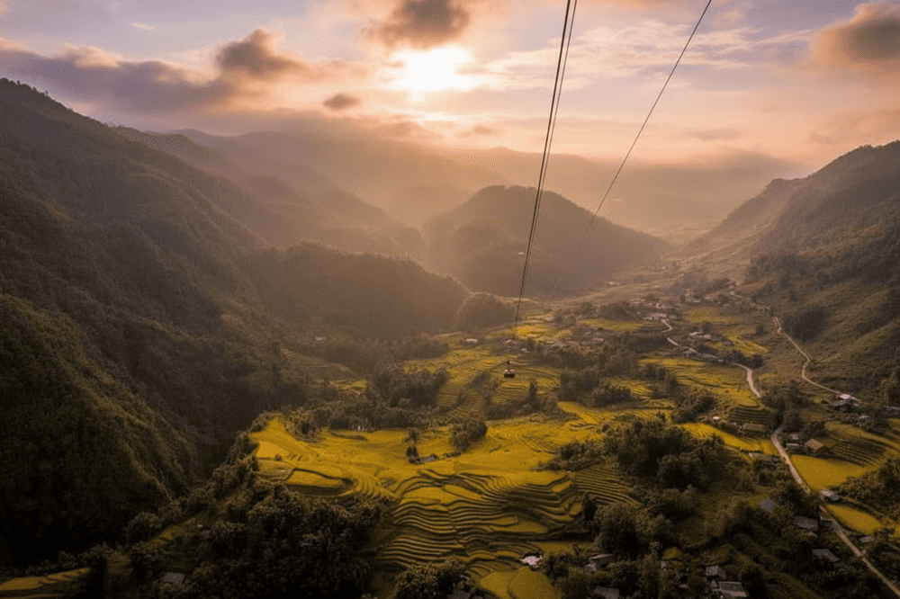 The majestic landscape of mountains and golden terraced fields in autumn.