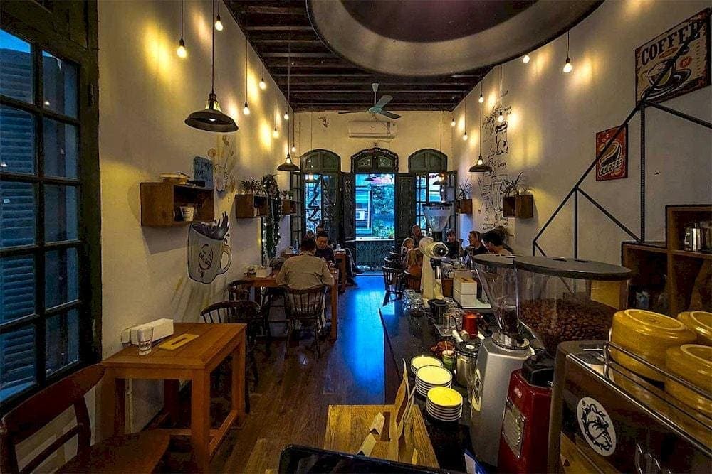 A rooftop café where you can sip coconut coffee while overlooking Hanoi’s Old Quarter