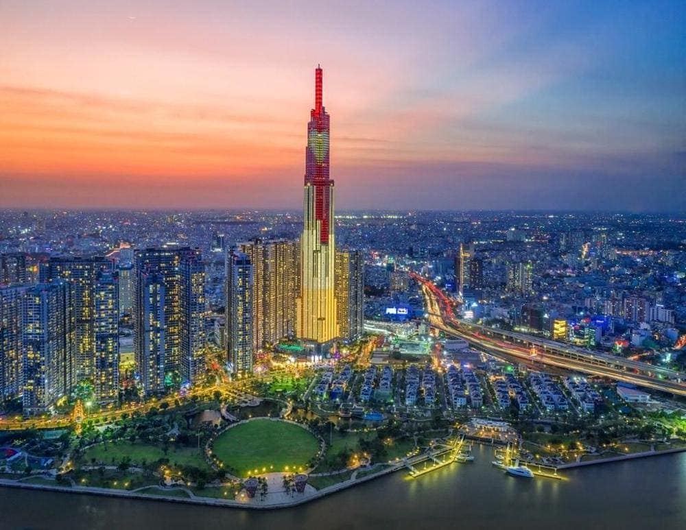 Panoramic sunset view of Ho Chi Minh City skyline showcasing the blend of modern development and traditional Vietnamese culture that attracts international residents