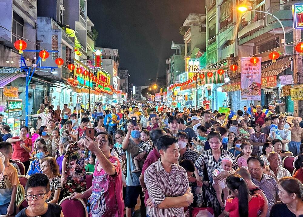 Steam rises from freshly made dumplings on bustling Ha Ton Quyen Street