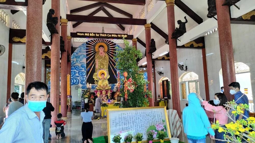 Locals pray at Van Hanh Pagoda hidden in a small alley