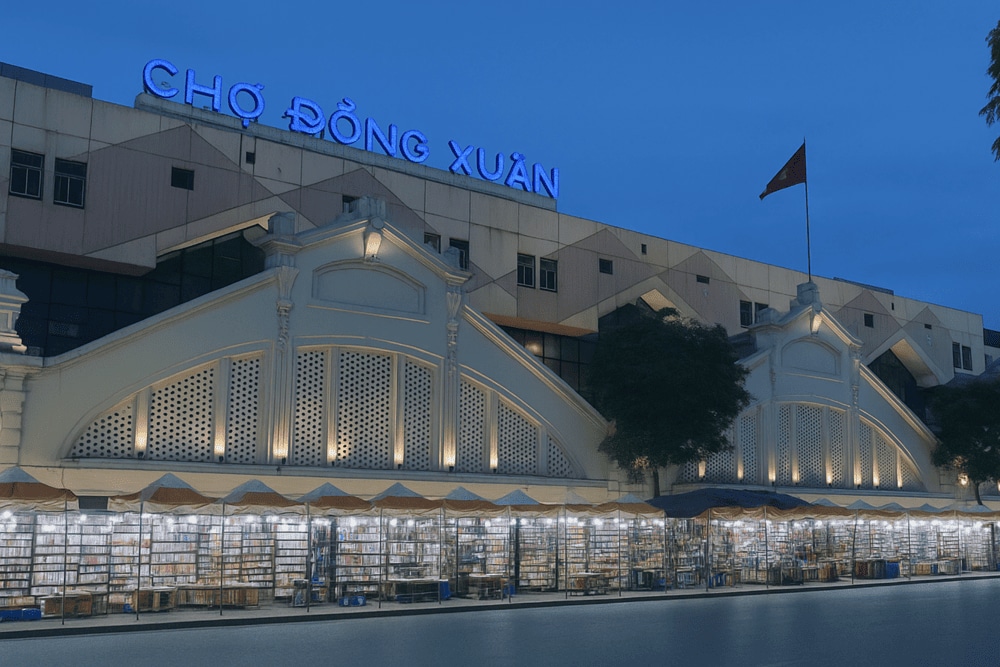 Dong Xuan Night Market is brightly lit and bustling with people