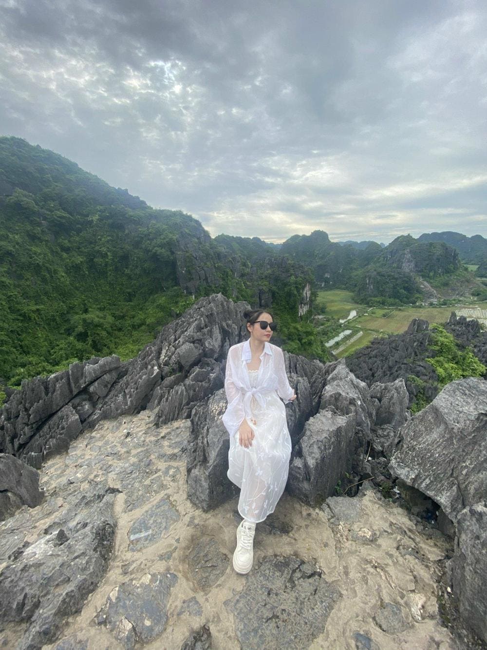 The stone stairway winds upward through cliffs and clouds, leading you to the breathtaking heights of Dragon Mountain Ninh Binh