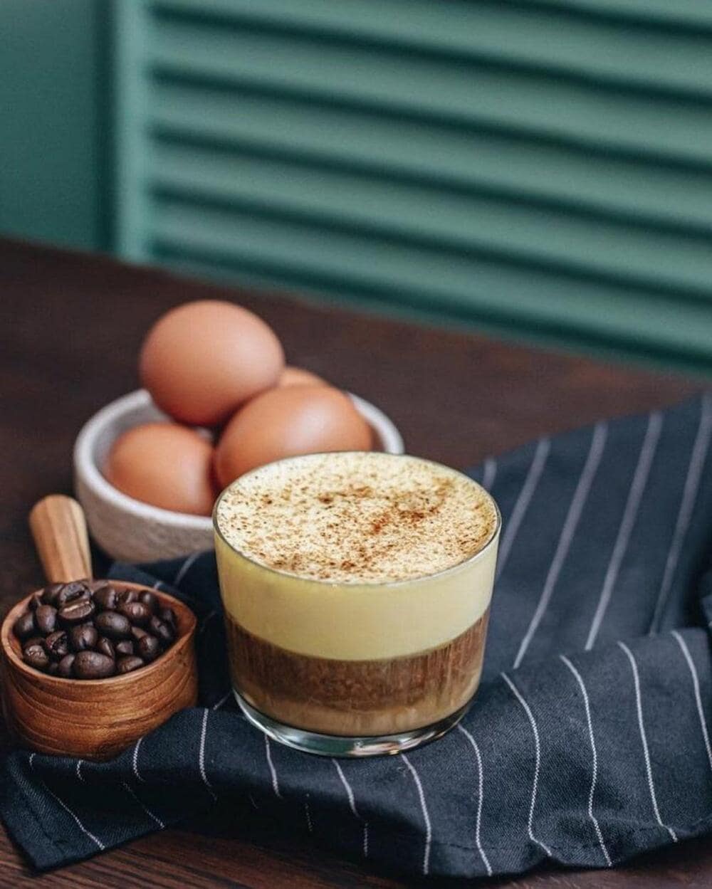 A classic Vietnamese egg coffee with a velvety egg foam topping, served in a ceramic cup. The perfect fusion of rich Robusta and sweetened egg cream