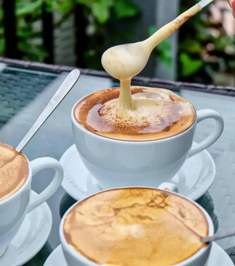 A hidden gem with minimalist decor, Q Coffee & Juice serves egg coffee made from organic ingredients and topped with silky egg foam