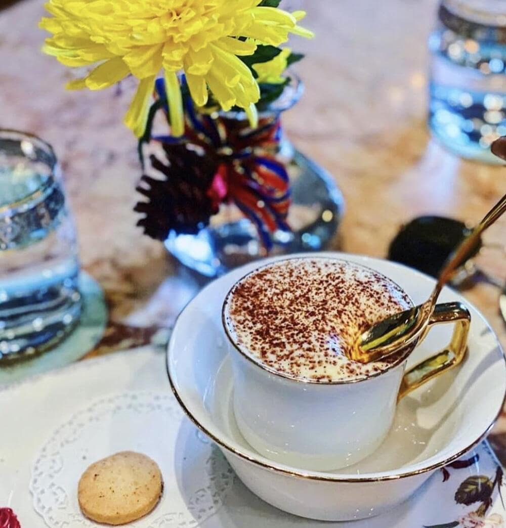 Enjoy premium egg coffee in an elegant setting at Runam D’Or — ideal for international travelers seeking a refined experience