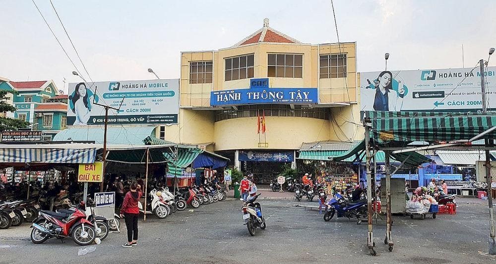 A bustling local market offering a variety of goods, from food to clothing