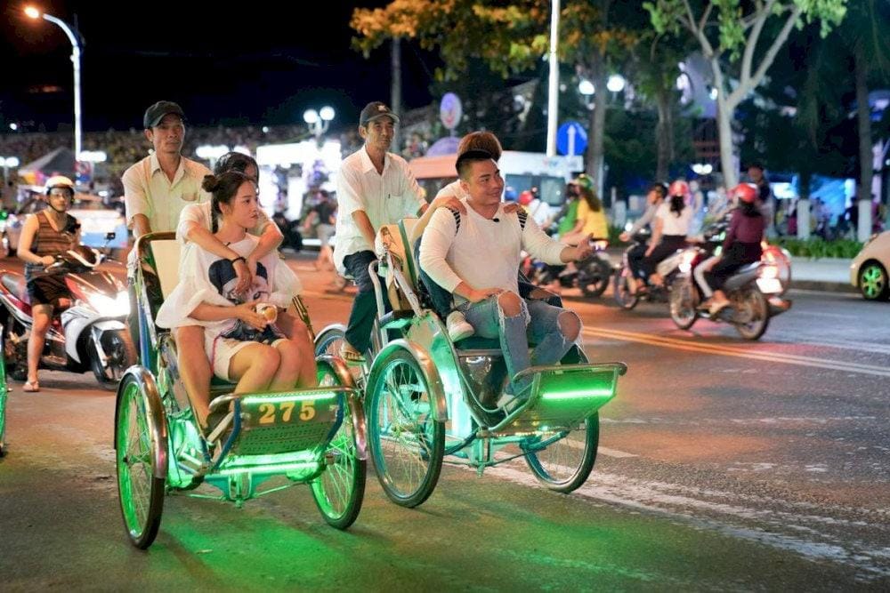 Features a 3-hour evening cyclo tour priced at $65 USD per person, which includes hotel pickup, a local guide, and a cyclo ride through Hue's illuminated streets