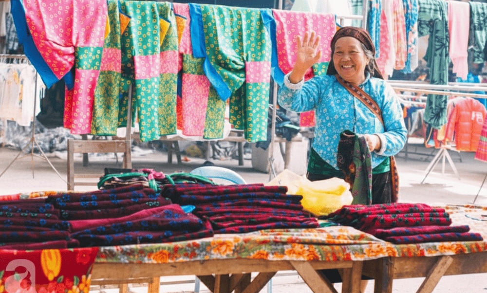 Colorful rows of fabric clothes at Meo Vac market