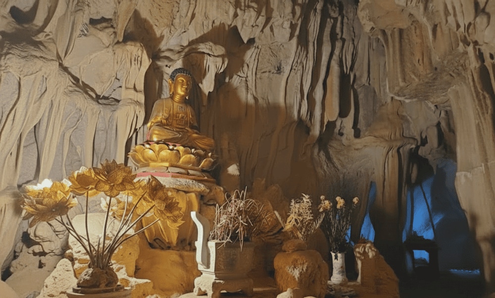 Light streams through a natural skylight, illuminating the sacred altar inside