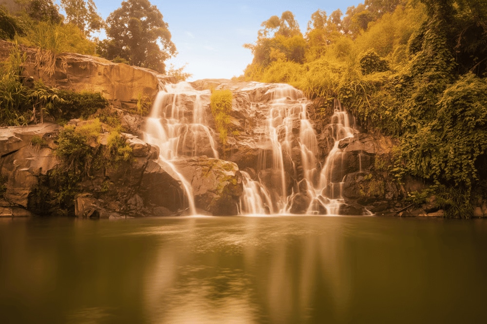 The serene flow of O Do Waterfall amid untouched forest surroundings
