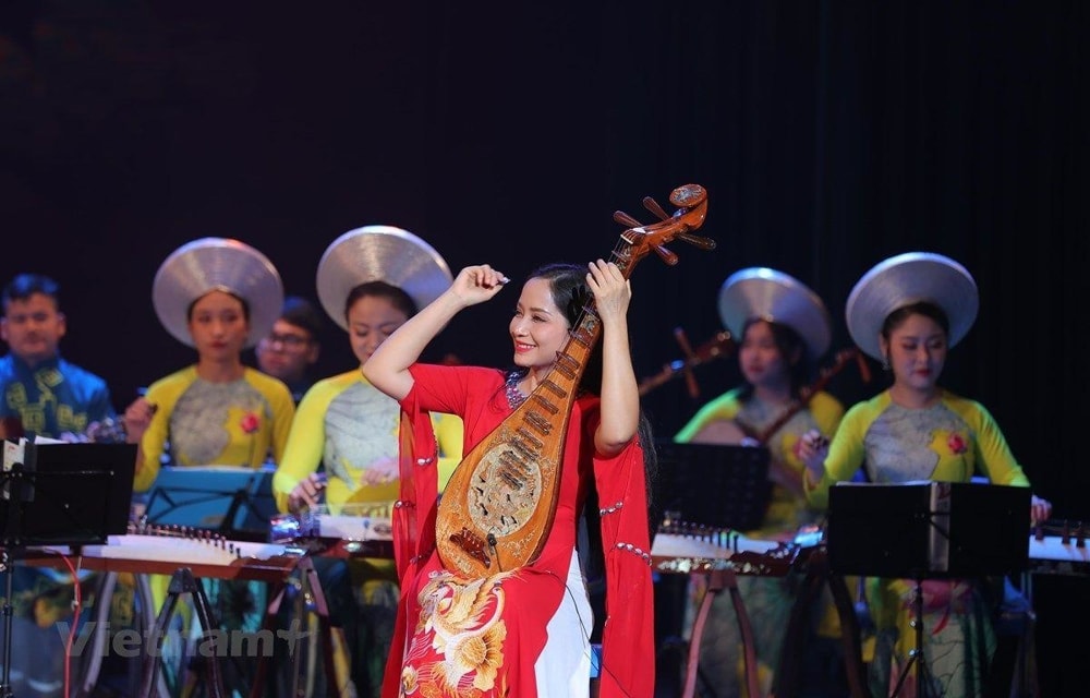Traditional musicians from different Vietnamese regions performing with their characteristic instruments.