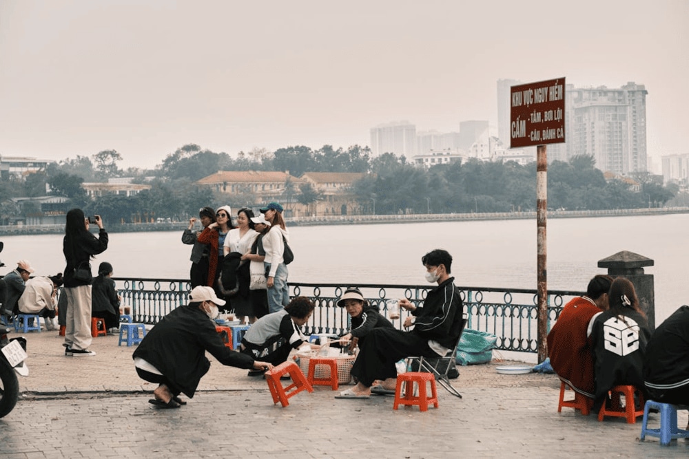 Enjoy your favorite beverage with the calming embrace of West Lake's morning serenity (Source: Pexels)