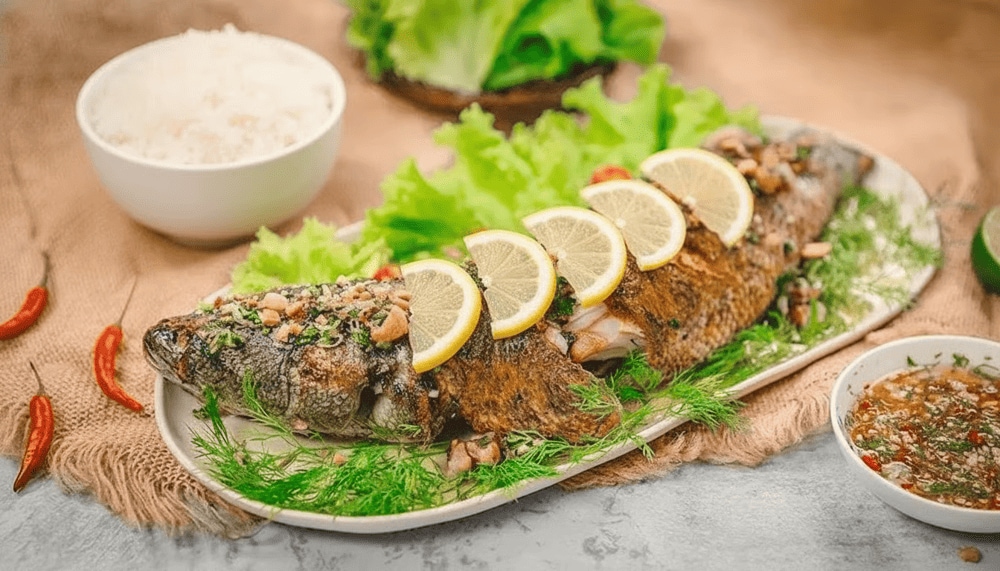 Fresh snakehead fish is grilled over hot coals, retaining its natural sweetness and rich aroma