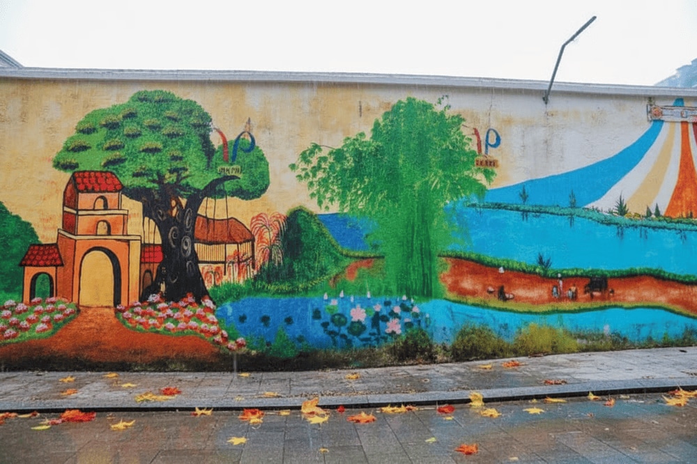 Located at the heart of the village, the mural serves as a perfect backdrop for memorable photos