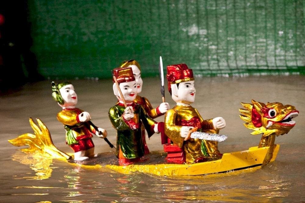 Puppeteers would wade through the water, making wooden puppets appear to dance and interact, bringing local legends and daily life to the stage