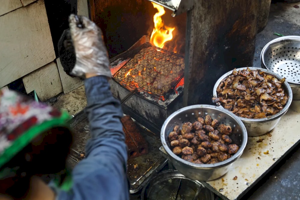 The pork is cooked over charcoal, ensuring a distinct smoky aroma