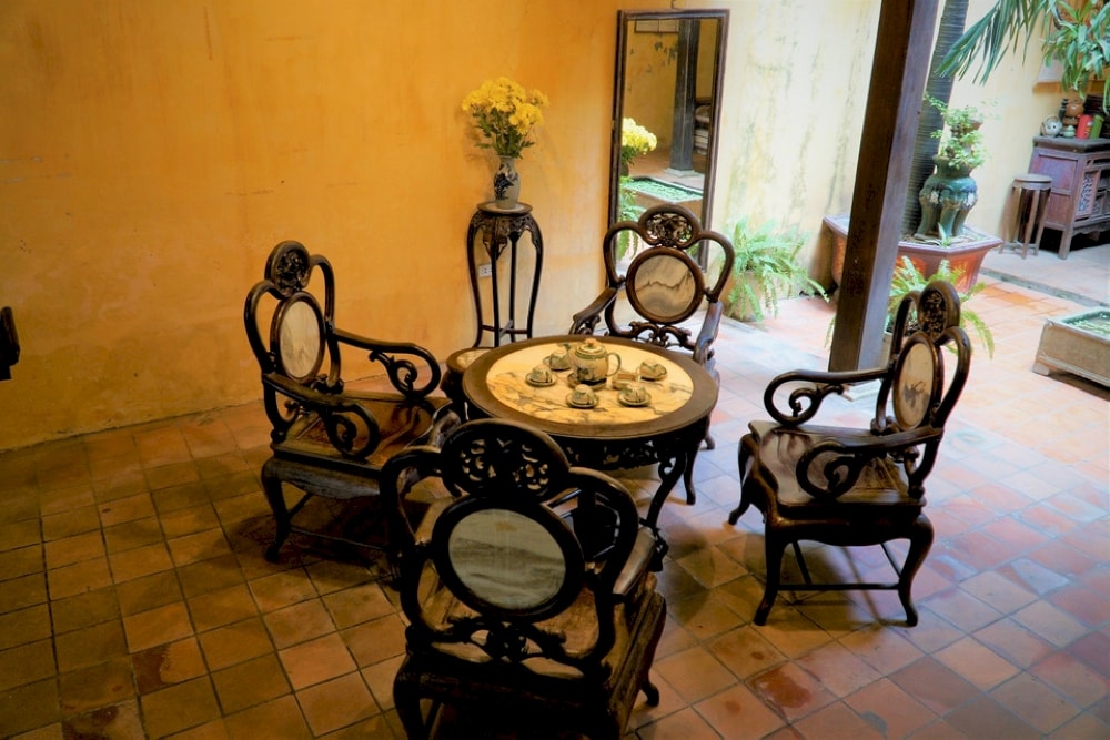 Antique table and chairs for guests in an ancient house on Ma May Street
