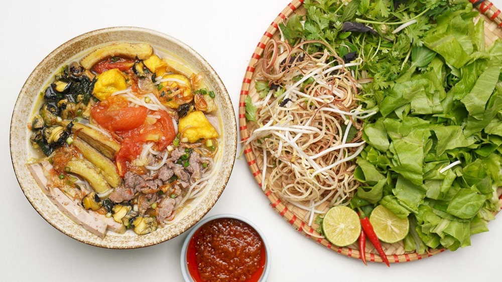 Aromatic bun oc with savory snails and a light, sour broth 