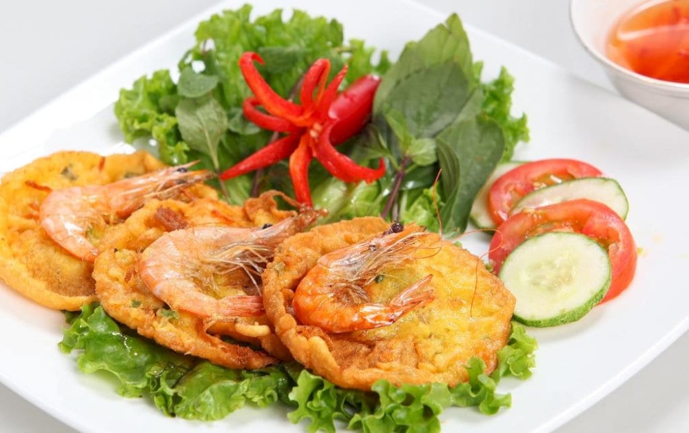 Delightful banh tom, combining crunchy batter with tender, flavorful shrimp