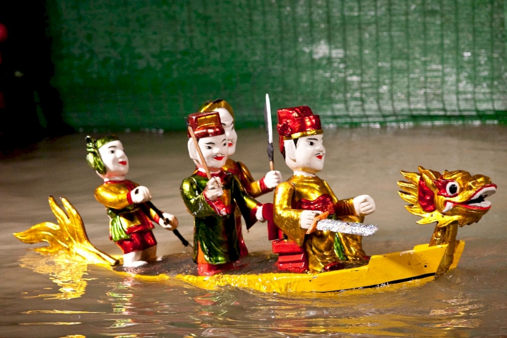 Puppeteers would wade through the water, making wooden puppets appear to dance and interact