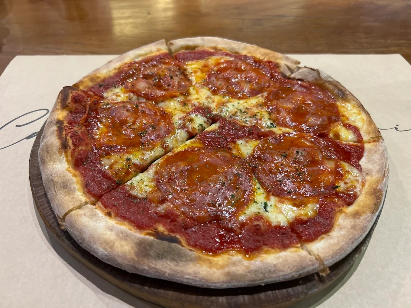 The Diavola pizza is known for its bold spicy salami and perfectly crisp crust that’s baked with rich tomato sauce and mozzarella