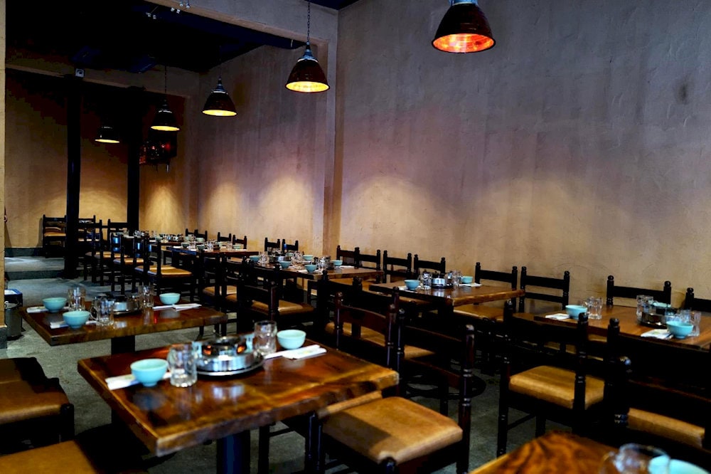 The space is large, clean, and modern with multiple floors and indoor seating, ideal for groups and families