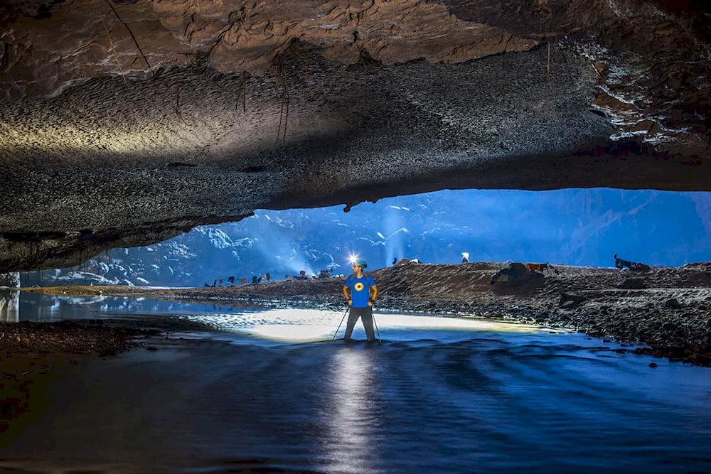 The rugged cliffs and sheer vertical walls inside the cave demonstrate the powerful geological forces at work during its creation