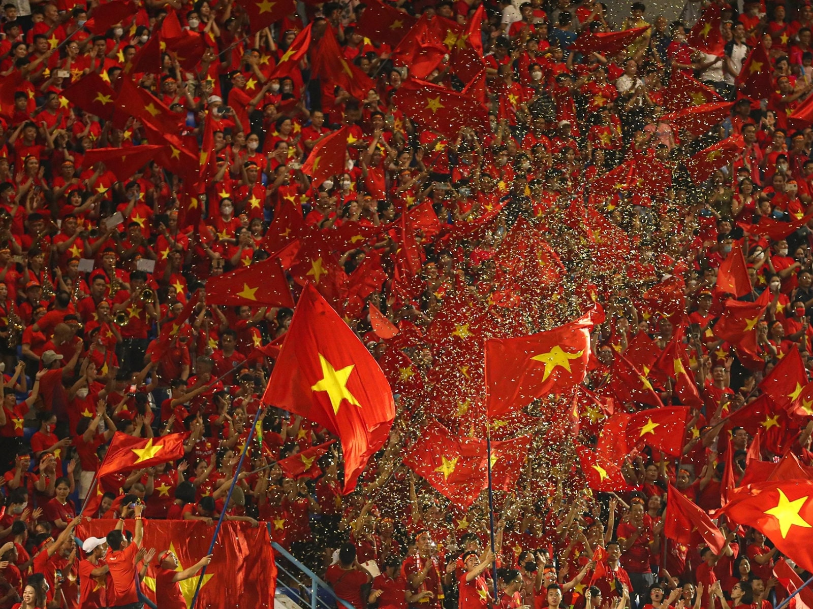 Fans wave thousands of flags in stadiums to express national pride and solidarity 