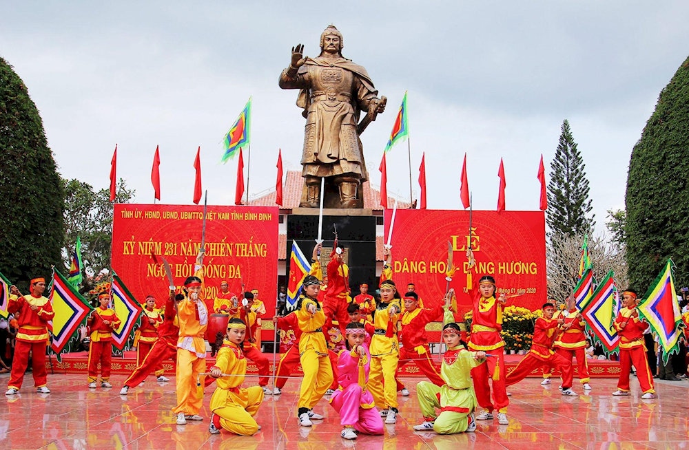 The anniversary of the Ngoc Hoi-Dong Da victory is commemorated with spirited dances and flags