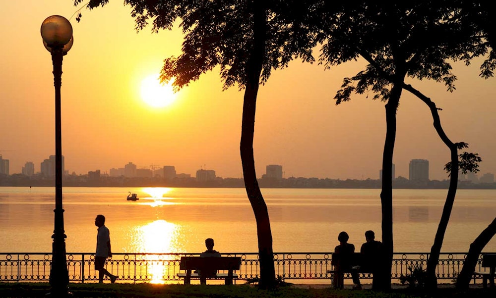 Visitors can walk around West Lake to watch the sunset 