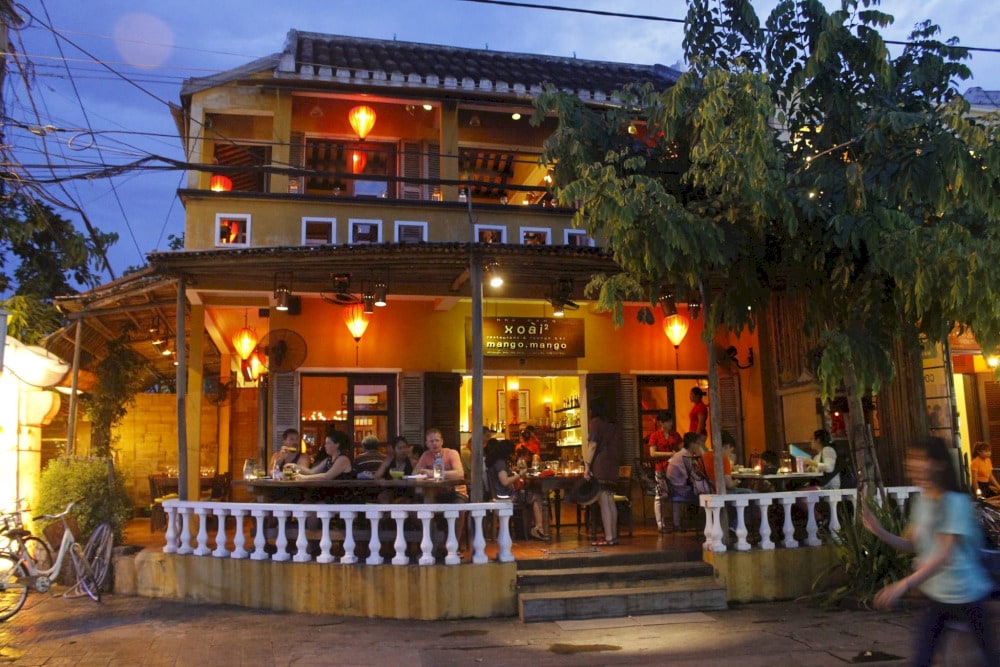 You need to make a reservation in advance if you want to sit at the table on the balcony overlooking the Thu Bon River