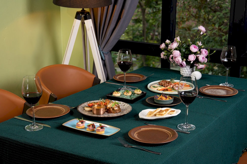 Fabrik offers a distinctive dining experience with its spacious and airy ambiance, adorned with classic and rock & roll-inspired decor