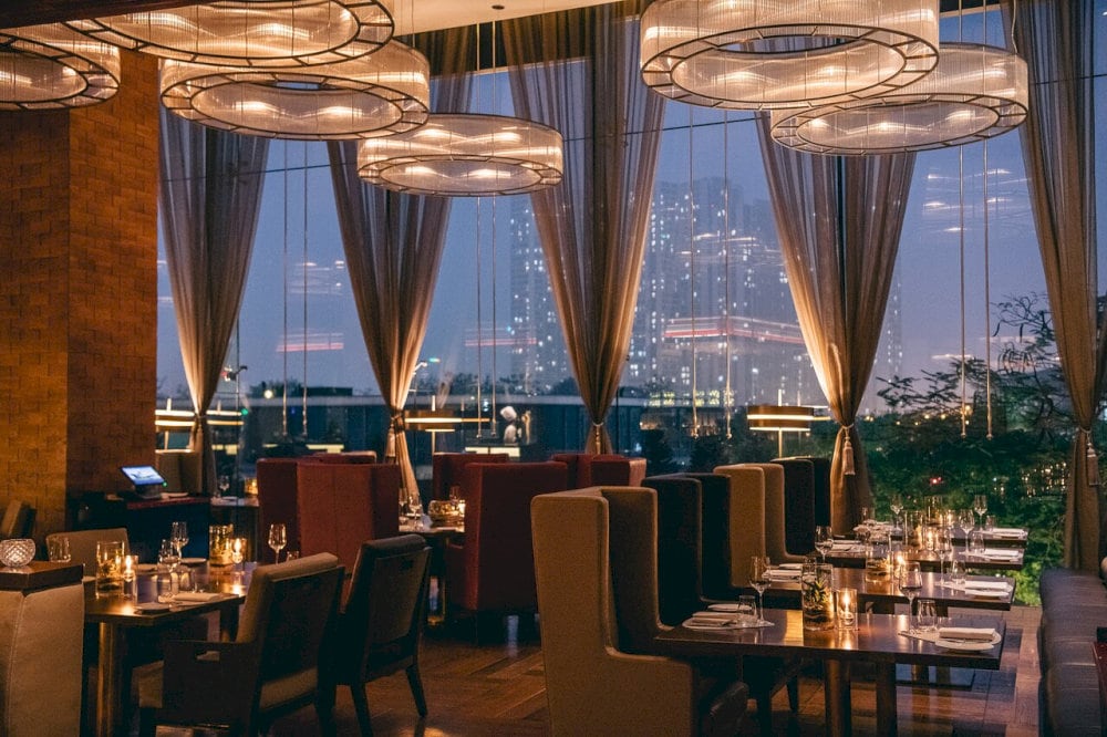 The restaurant's atmosphere is both cozy and luxurious, offering a warm and sophisticated environment for guests to enjoy their dining experience