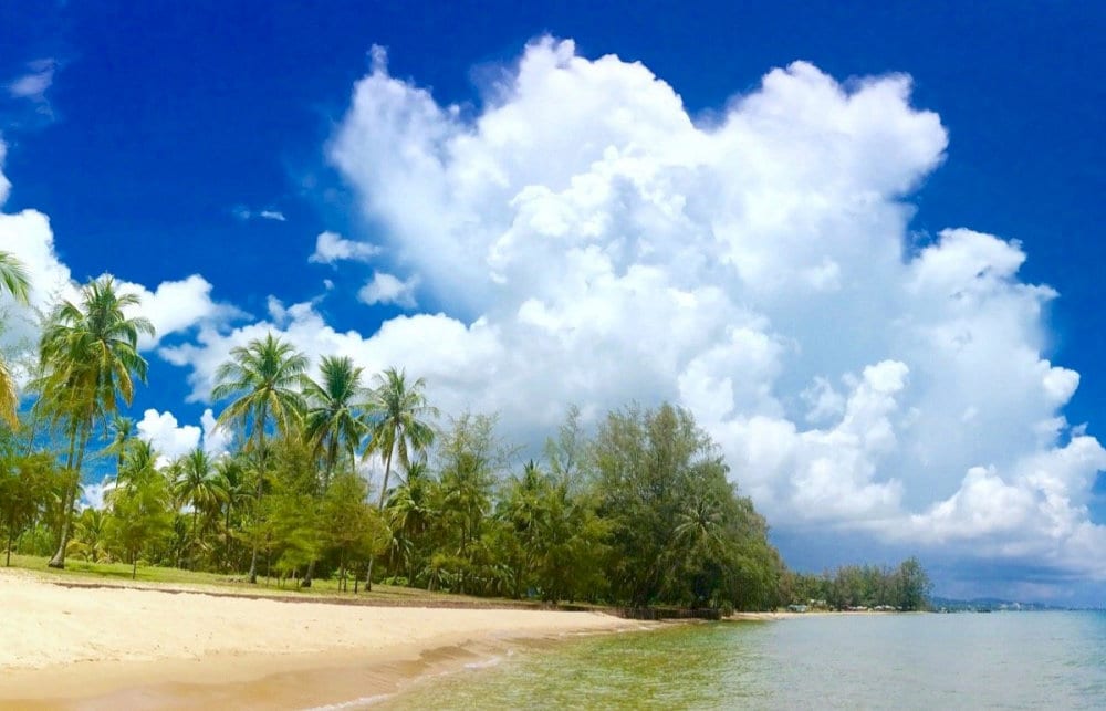The beach remains largely untouched by crowds, preserving its pristine natural beauty