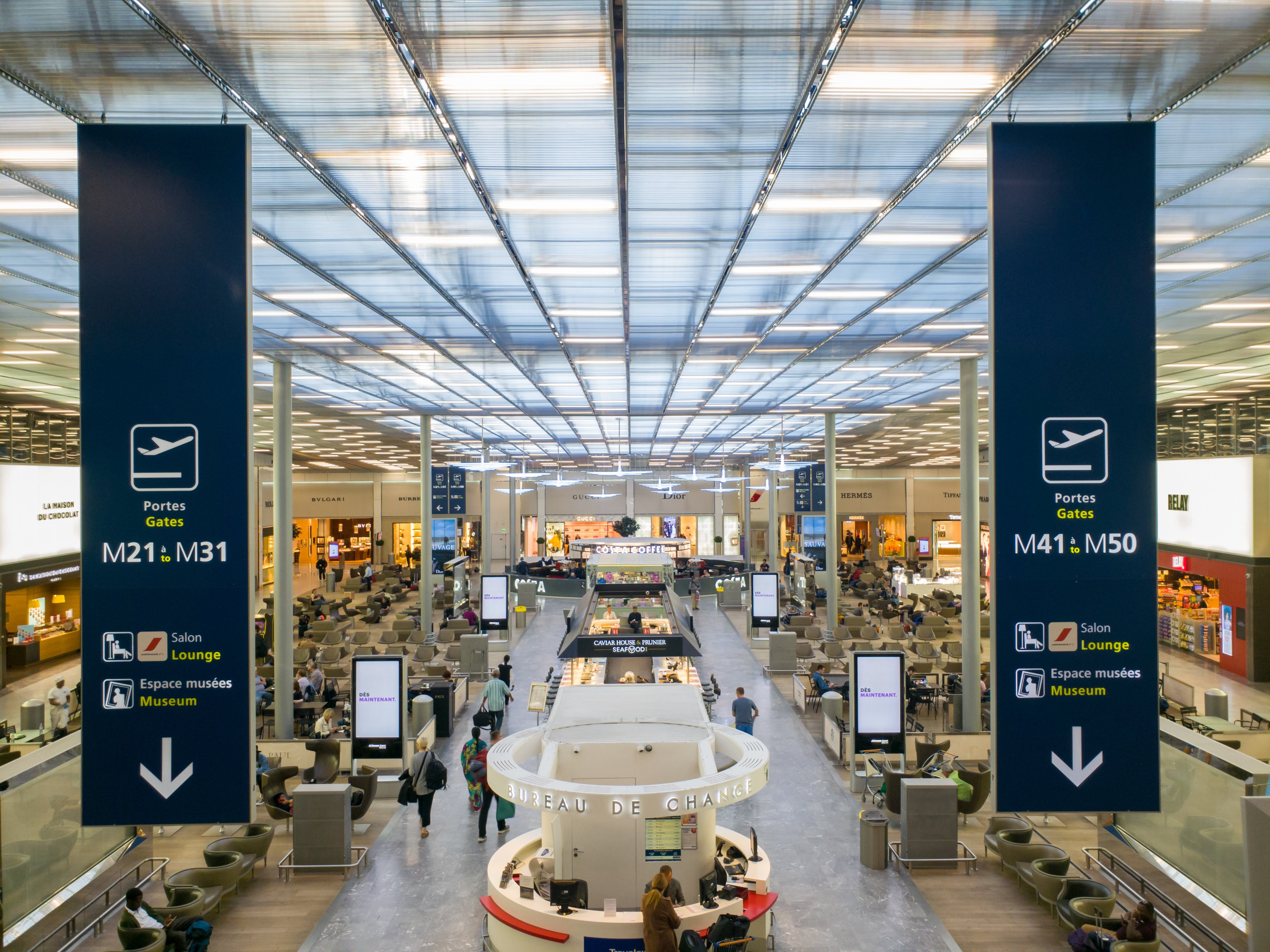 Charles de Gaulle Airport with terminals, shops and passenger facilities creating the atmosphere of a small city