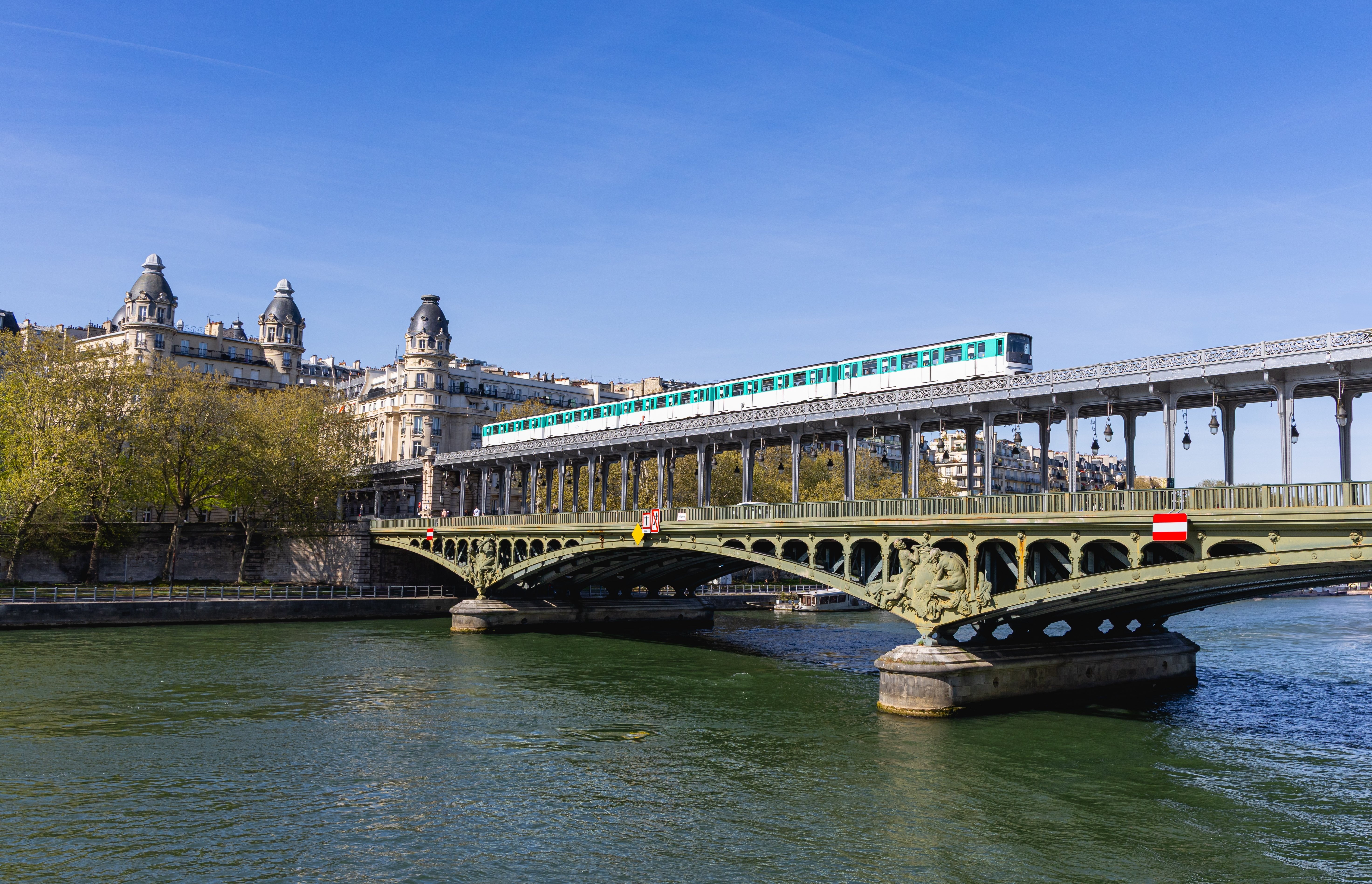 Paris airport train crossing a historic bridge in France, connecting travellers to the city