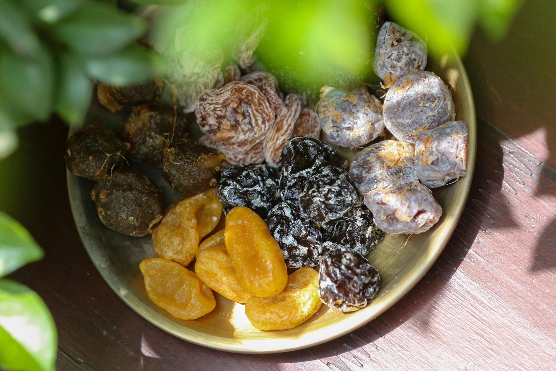 A selection of dried fruits and local specialties displayed at a Da Nang shop.