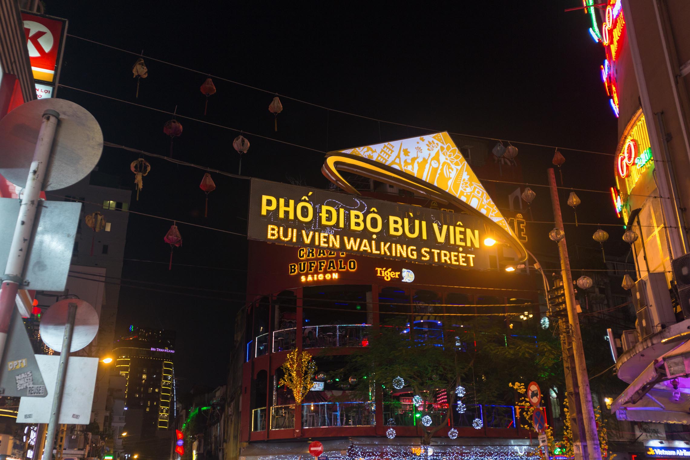 Bui Vien comes alive under glowing lights on a vibrant night in Ho Chi Minh City