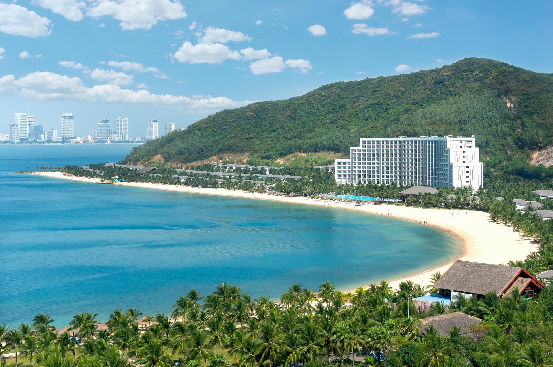 Panoramic view of Nha Trang Bay with hotels in Nha Trang lining the scenic coastline.