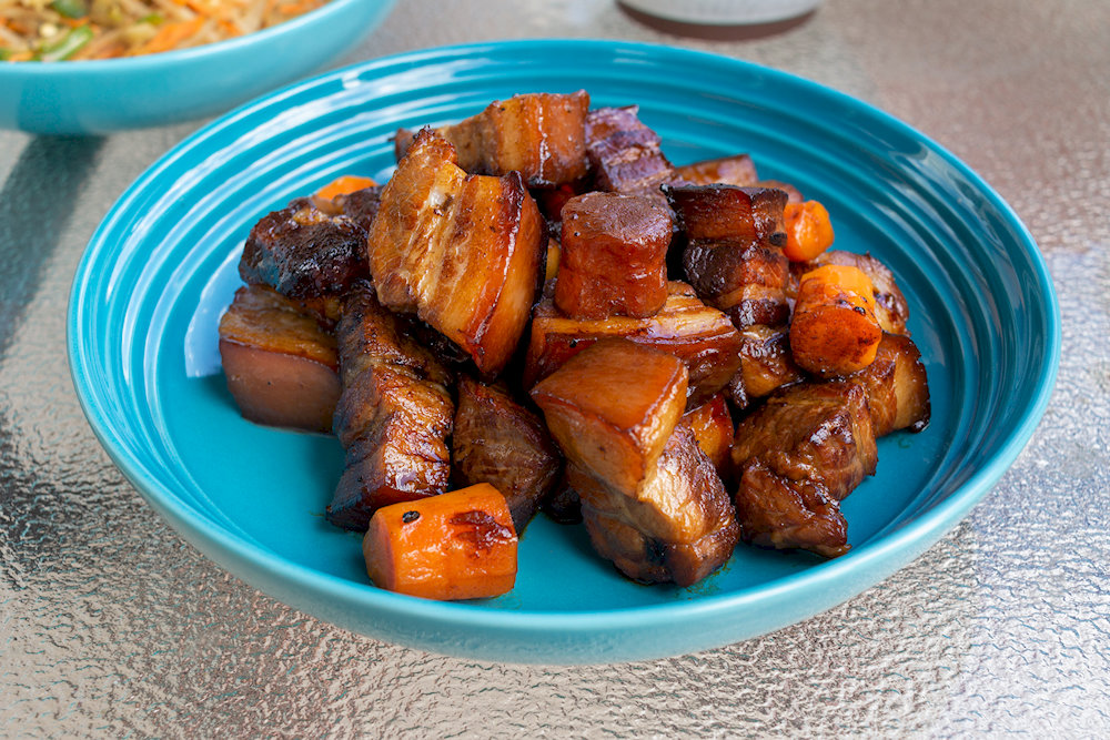 Pork belly is braised until tender and covered with a characteristic red color